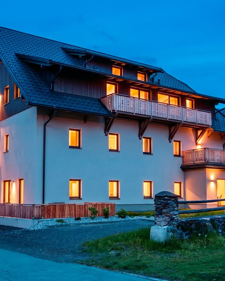 Rattendorf 26 at blue hour, windows lit